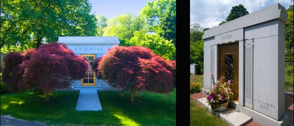Private mausoleums in a serene cemetery backdrop; larger mausoleum with red-leaved trees, smaller structure adorned with decorative columns and vibrant flowers - crafted by Forever Legacy, premier custom mausoleum services.
