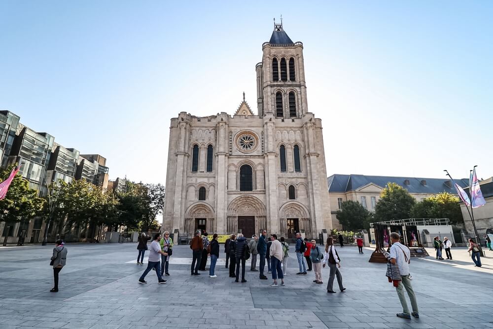 Crowds gather in front of the Basilica of Saint Denis in France.
